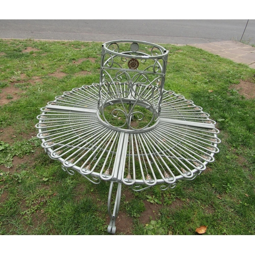 1074 - A contemporary cast aluminium sectional tree seat with open scroll and repeating loop and foliate de... 