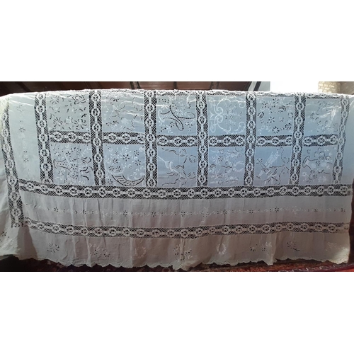 441 - Collection of assorted vintage white and coloured table linen including a large white table cloth wi... 