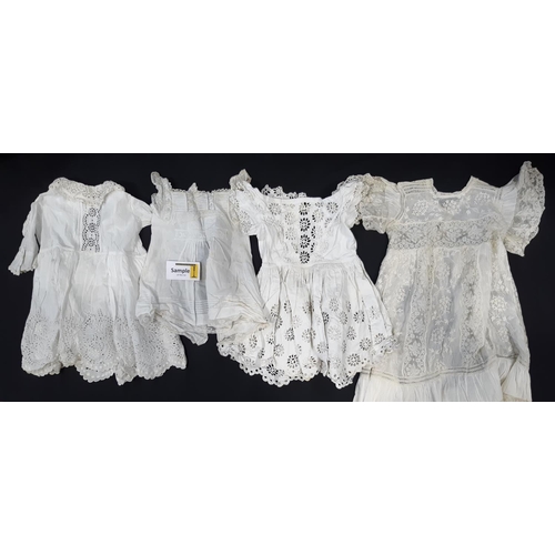 447 - Collection of late 19th/ early 20th century baby clothing comprising 6 white baby gowns, with variou... 