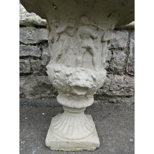 1110 - A pair of weathered cast composition stone campana shaped garden urns with flared rims, lions mask a... 