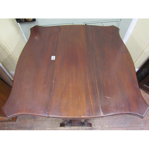 1684 - An Edwardian mahogany drop leaf table of narrow proportions, enclosing two frieze drawers with shape... 