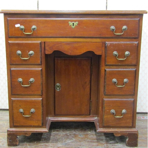 1644 - 19th century mahogany kneehole writing desk, the central kneehole cupboard surrounded by an arrangem... 