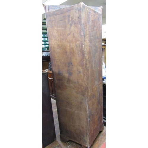 1673 - A Georgian mahogany free standing corner cupboard, the lower section enclosed by a panelled door, th... 