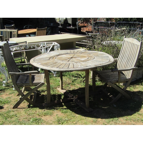 1086 - A Firman weathered hardwood garden table with circular radiating slatted top, raised on square cut s... 