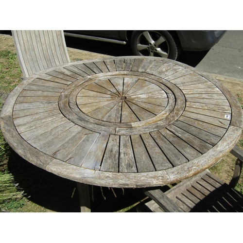 1086 - A Firman weathered hardwood garden table with circular radiating slatted top, raised on square cut s... 