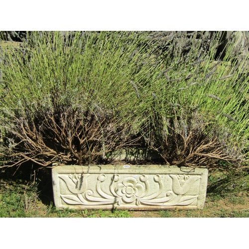 1087 - A pair of weathered cast composition stone flower troughs of rectangular form, with foliate relief d... 