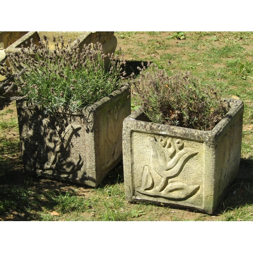 1087 - A pair of weathered cast composition stone flower troughs of rectangular form, with foliate relief d... 