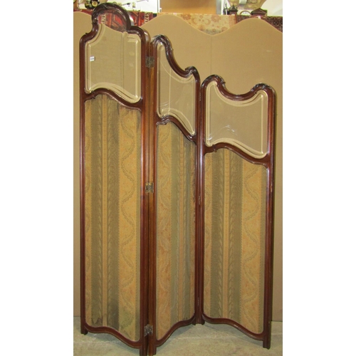 1319 - An Edwardian mahogany three fold room divider/screen with three quarter length fabric covered panels... 