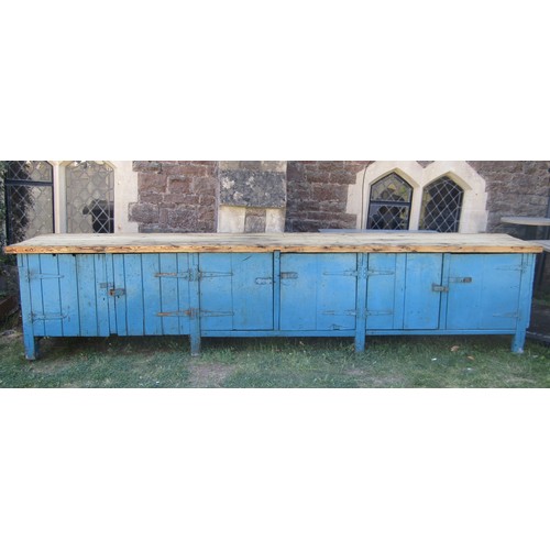 1096 - A substantial vintage partially painted pine workbench/counter of tongue and groove boarded construc... 