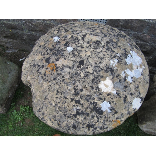 1064 - A good weathered natural stone staddlestone of square tapered form beneath a domed cap, 60cm diamete... 