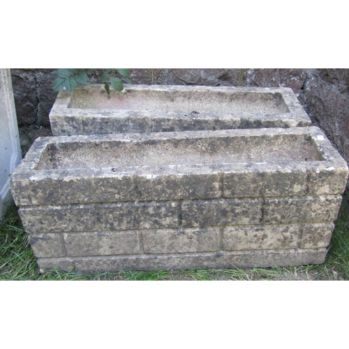 1067 - A painted and weathered cast composition stone flower trough of rectangular form with raised butterf... 