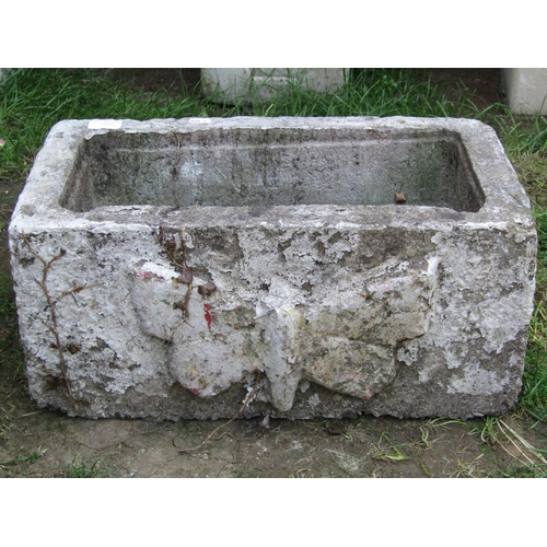 1067 - A painted and weathered cast composition stone flower trough of rectangular form with raised butterf... 