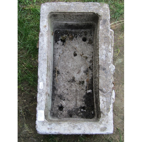 1067 - A painted and weathered cast composition stone flower trough of rectangular form with raised butterf... 