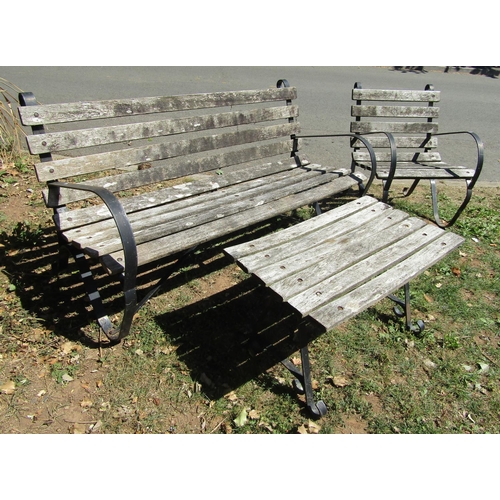 1079 - A vintage sprung steel garden bench  with weathered timber lathes, 150cm wide, together with a match... 