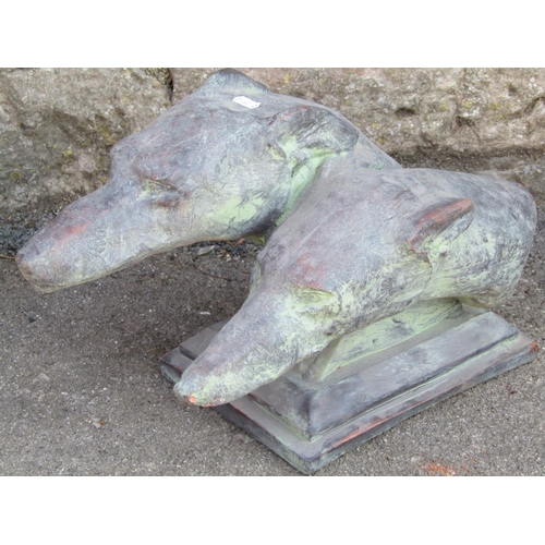 1107 - Cast composition stone garden ornament/study in the form of two greyhound heads raised on a rectangu... 