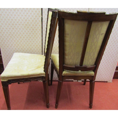 1669 - A pair of 19th century continental mahogany side chairs with carved framework, upholstered seas and ... 