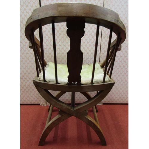 1687 - A 19th century Chinese hardwood chair with horseshoe shaped back raised on x shaped supports, uphols... 