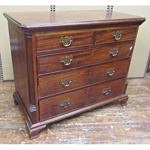 1648 - A small Georgian mahogany chest of three long and two short drawers, set within reeded and canted co... 