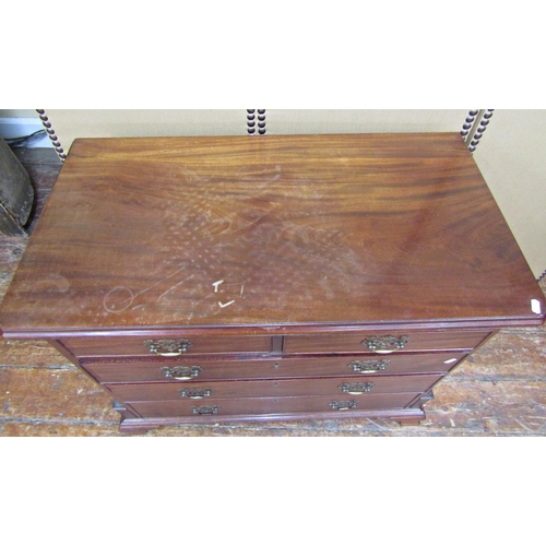 1648 - A small Georgian mahogany chest of three long and two short drawers, set within reeded and canted co... 