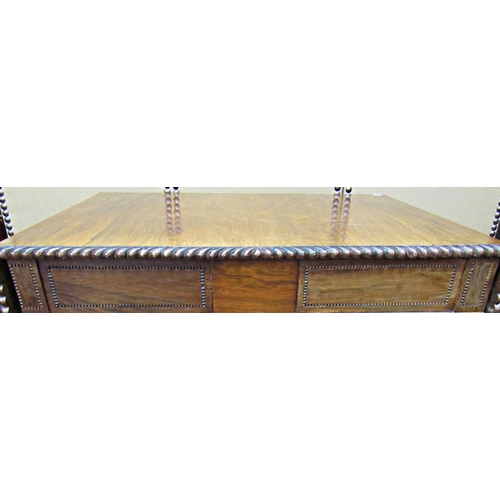 1659 - A Regency rosewood sofa table, raised on a stretcher base, the top with gadrooned borders, the base ... 