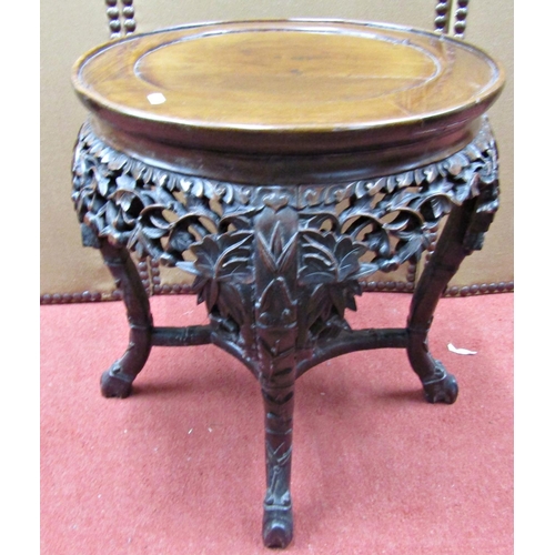 1660 - A 19th century Chinese hardwood occasional table, the circular top raised on four carved supports, u... 