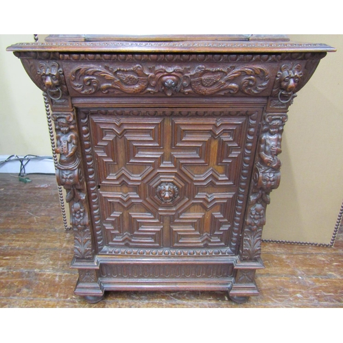 1666 - A mid-19th century gothic oak revival pier cabinet, the lower section enclosed by a panelled door wi... 