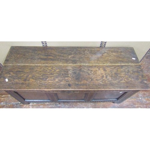 1678 - An old English oak coffer with panelled framework and repeating carved detail, 117cm wide