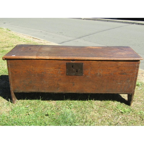 1681 - An 18th century elm six plank coffer, with steel lock plate dated 1763, monogrammed I.B.? 115cm wide