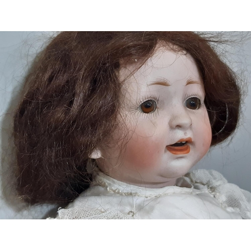 539 - Small early 20th century bisque head character doll with composition bent limb body, closing brown e... 