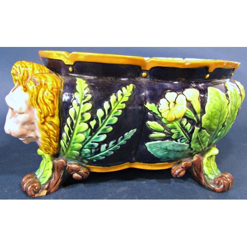 16 - A 19th century majolica jardinière of quatrefoil shape, with primrose, fern and other detail, with l... 