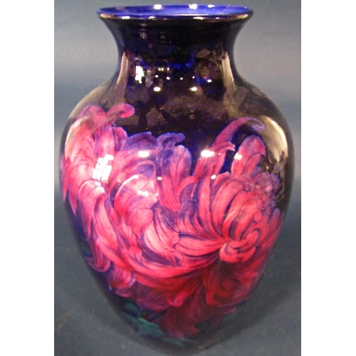 37 - A George Jones oviform vase - Imperial Rouge, decorated with chrysanthemums on a dark blue ground