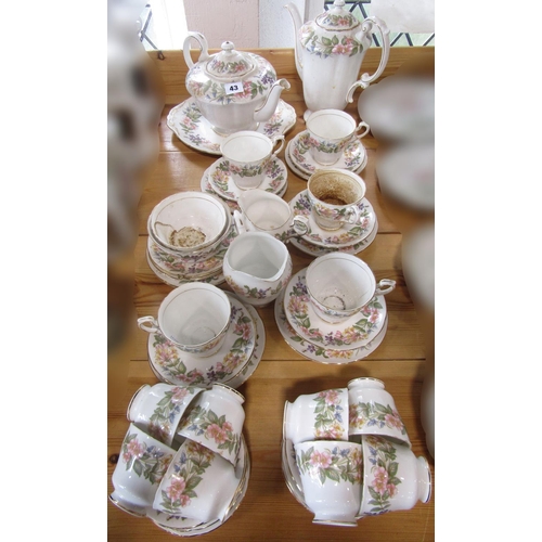 43 - A Paragon Country Lane pattern collection of tea and coffee wares with repeating honeysuckle and oth... 