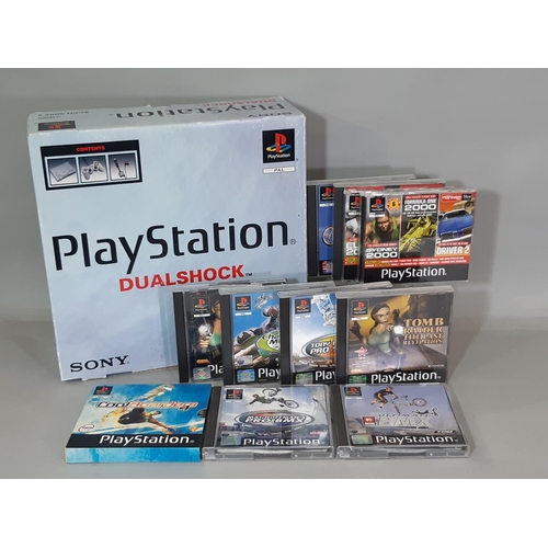 578 - Sony PlayStation Dual Shock (SCPH-9002B) boxed with cables, consoles, instructions and a range of ga... 