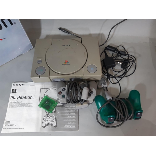 578 - Sony PlayStation Dual Shock (SCPH-9002B) boxed with cables, consoles, instructions and a range of ga... 