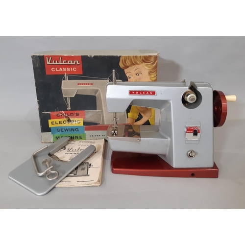 557 - Vintage child's sewing machine 'Vulcan classic' with instructions, extension work table and clamp, i... 