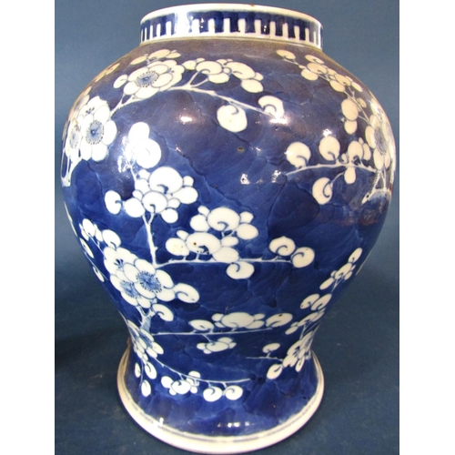 62 - An oriental blue and white vase of baluster form with prunus blossom decoration, 27cm tall approx, t... 