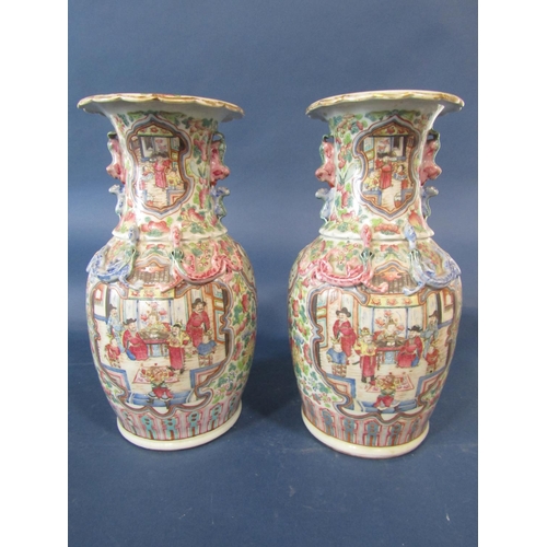 64 - Pair of 19th century Cantonese vases each with all over famille rose floral decoration with large sc... 