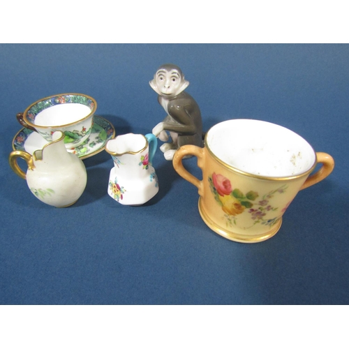 70 - A collection of miniature ceramics to include four lidded pill boxes, cup and saucer, two handled cu... 