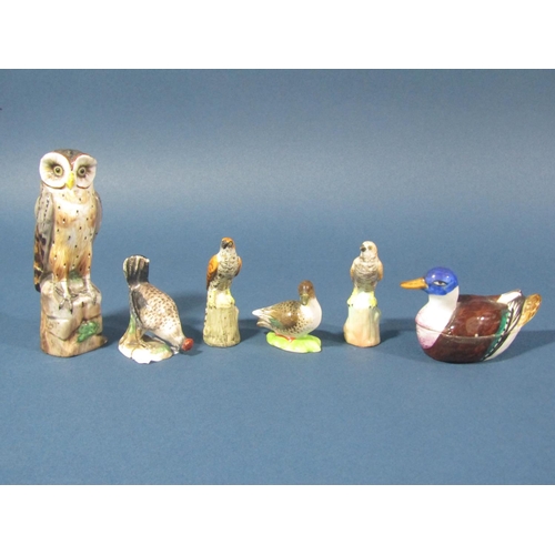 71 - A collection of miniature ceramics of birds comprising an owl, two birds of prey (possibly kestrels)... 