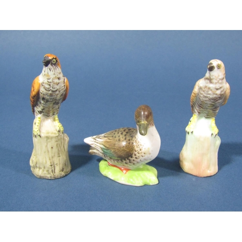 71 - A collection of miniature ceramics of birds comprising an owl, two birds of prey (possibly kestrels)... 