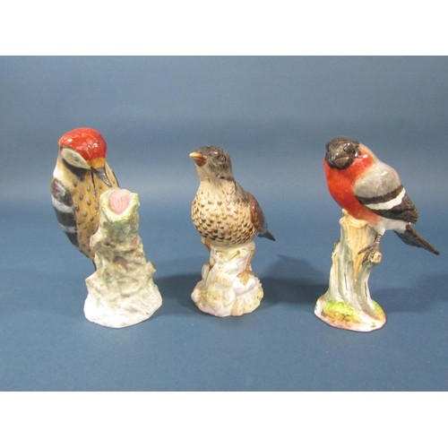 81 - A collection of three ceramic birds comprising woodpecker, bullfinch, thrush, 14cm tall approx