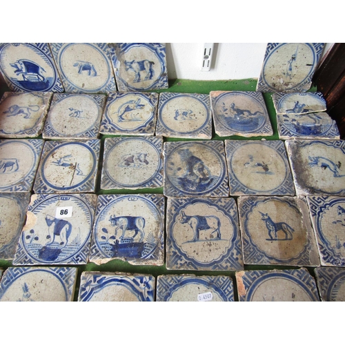 86 - A collection of 28 18th century Dutch Delft tiles, hand painted in blue and white, each depicting an... 