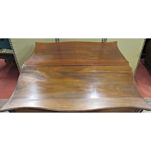 1547 - Georgian mahogany serpentine foldover tea table raised on four square moulded supports, enclosing a ... 