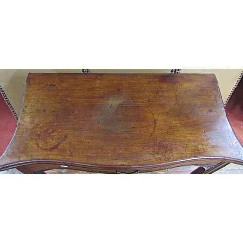 1547 - Georgian mahogany serpentine foldover tea table raised on four square moulded supports, enclosing a ... 