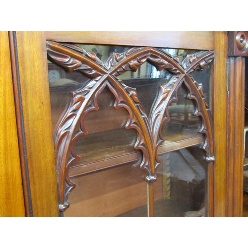 1548 - Small Regency mahogany library bookcase, the lower section enclosed by a pair of panelled doors with... 