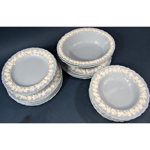 103 - A collection of Wedgwood blue ground china dinner and table wares with embossed low relief white fru... 