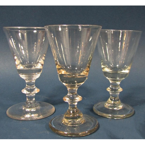 112 - Three Georgian baluster wine glasses, two further floral engraved wine glasses and a smaller engrave... 