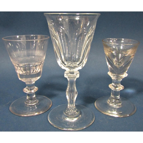 114 - A Georgian facetted baluster wine glass on a facetted stem, a conical shaped wine glass with two oth... 