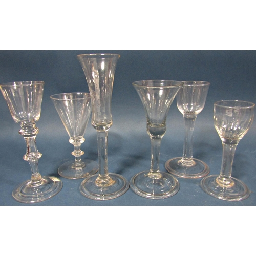 115 - Four Georgian solid stemmed wine glasses of varying design , a flared conical wine glass with waiste... 