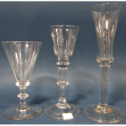 115 - Four Georgian solid stemmed wine glasses of varying design , a flared conical wine glass with waiste... 